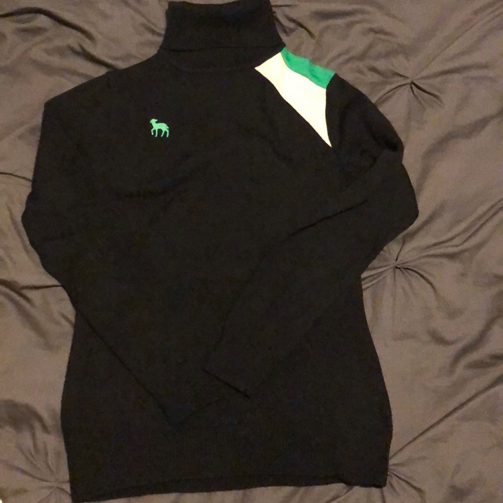 L.A.M.B black turtleneck sweater.